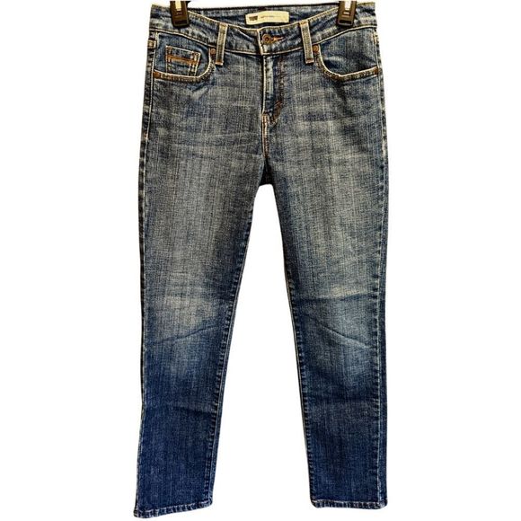 Levi's mid rise skinny jeans in a mid wash in a women's size 4. - Picture 1 of 6